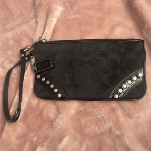 Coach wristlet in black some wear